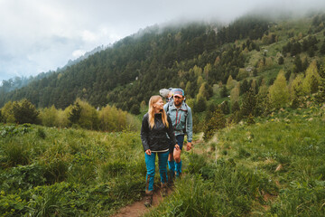 travel family lifestyle group people hiking in foggy forest mountains adventure vacations tour outdo