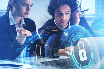 Poster - Businessman and businesswoman are looking at laptop and working