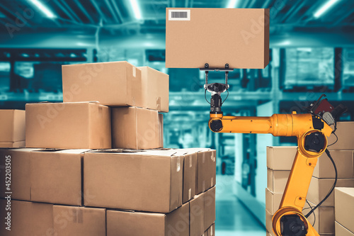 Smart robot arm system for innovative warehouse and factory digital technology . Automation manufacturing robot controlled by industry engineering using IOT software connected to internet network .