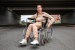 © Aliaksandr Marko - A young disabled girl sits in a wheelchair on the street. The concept of a wheelchair, disabled person, full life, paralyzed, disabled person, health care.