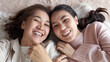 © ChayTee - POV attractive beautiful two people asia young lady girl use mobile phone take photo picture video overjoy lying down at home floor have good time day together quarantine in mum healthy health care.