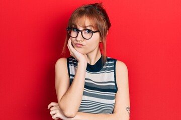 Poster - Redhead young woman wearing casual clothes and glasses thinking looking tired and bored with depression problems with crossed arms.