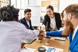 © Krakenimages.com - Group of business workers smiling happy celebrating with hands together at the office.