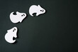 © Denira - Handmade kids craft paper ghost halloween party on black background