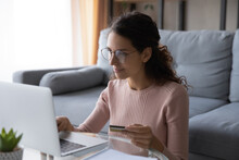 Young Latina Woman Purchasing On Internet Use Laptop Entering Credit Card Data, Makes Instant Funds Transfer, Spend Money Buying On-line, Enjoy Easy Comfort E-shopping On E-commerce Services Concept