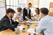 © Krakenimages.com - Group of young business workers listening boss speech during meeting at the office.
