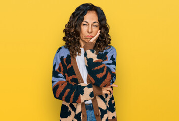 Sticker - Middle age hispanic woman wearing casual clothes thinking looking tired and bored with depression problems with crossed arms.