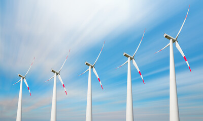 Wind turbines generating electricity with clouds are flying in a windy day