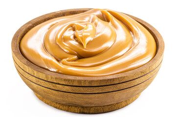 wooden bowl with homemade dulce de leche, condensed cream or pasty caramel, isolated white background.