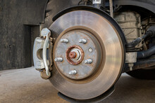 Vehicle Brakes Parts. Caliper And Rotor On Car. Brake Inspection, Repair, Service And Maintenance Concept