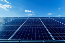 Photovoltaic Solar Panels On Blue Sky Background