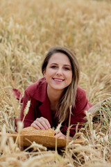 Sticker - girl with straw hat on a yellow wheat field