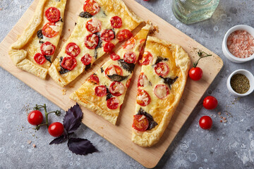 Wall Mural - Puff pastry tart with cherry tomatoes, mozzarella and purple basil