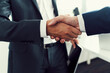 © baranq - Business handshake closeup. Two businessman shaking hands after successful recruitment