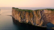 Aerial View Of The Rocher Percé In The City Of Percé In Quebec, Canada, At Sunset, From Drone