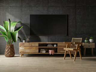 Loft space empty room with tv and cabinet on dark concrete interior background.