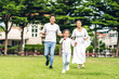 © Art_Photo - Portrait of enjoy happy love asian family father and mother with little asian girl smiling running playing and having fun moments good time in summer park at home