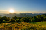 Fototapeta Na ścianę - Amazing mountain landscape with colorful vivid sunset on the cloudy sky