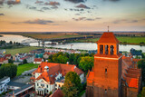 Fototapeta Miasto - Beautiful landscape of Tczew by the Vistula River at sunset. Poland