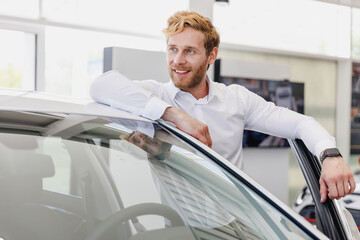 Wall Mural - Pensive man customer buyer businessman client in white shirt look aside get out car chooses auto want buy new automobile in showroom vehicle salon dealership store motor show indoor Car sales concept.