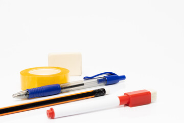 Sticker - Closeup of school supplies on white background.