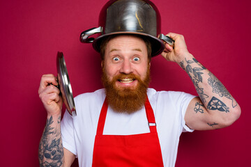 Poster - Happy chef with beard and red apron plays with pot