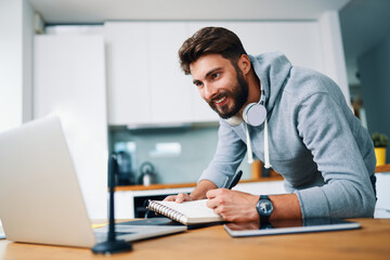 Wall Mural - Creative young man working from home