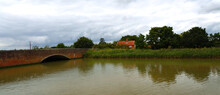 Bridge Over The River Alde At Snape With Reeds And Cottage