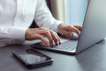 Closeup hands business working at office, Man typing keyboard on laptop or computer