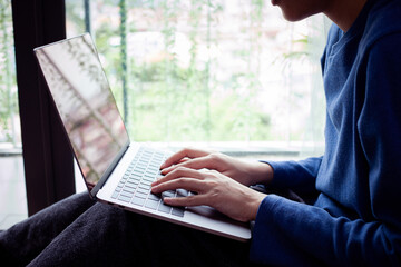 Closeup woman working remotely at home, Man typing on laptop or computer