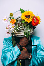 Fine Art Concept With Man Wearing A Space Helmet And Flowers Composition