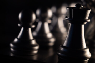 Poster - Closeup shot of chess pieces on dark background