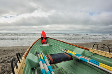 life saving gear and oars inside a beach patrol rowboat on a new jersey beach