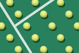 Fototapeta Sport - Pattern of pastel tennis balls on a tennis court. Minimal creative sports concept.