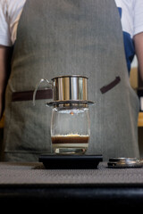 Canvas Print - Vertical shot of a portable stainless steel Vietnamese coffee dripper