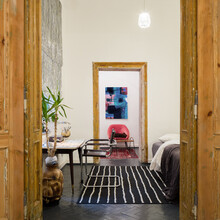 View From Wooden Doors To Bedroom In Tenement House