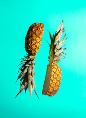 Wall Mural - Sliced juicy pineapple on pastel background. Minimal fruit concept. Modern food composition.