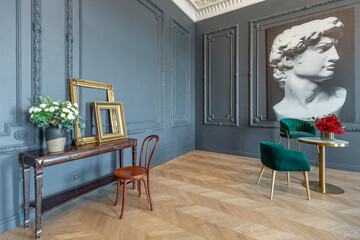 Wall Mural - chic interior of the room in the Renaissance style of the 19th century with modern luxury furniture. walls of noble dark color are decorated with stucco and gilded frames, wooden parquet.