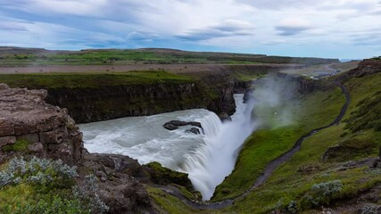 Wall Mural - Iceland travel video. Timelapse of Gullfoss waterfall tourist attraction destination. Icelandic waterfalls, famous attraction on the Golden circle. AKA Golden Falls. 8K available