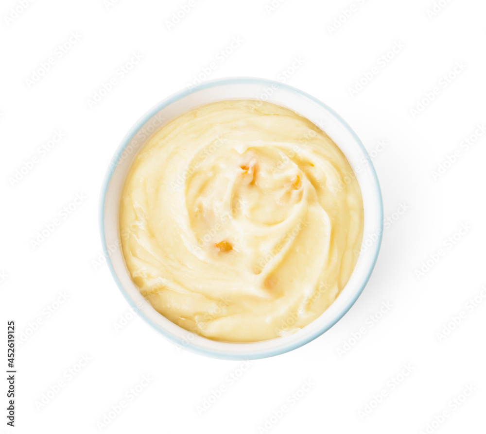 Bowl of tasty mashed potatoes with garlic on white background