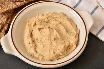 Canvas Print - Bowl of hummus overhead view, close up