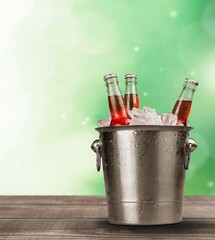 Canvas Print - Bottles of cold and fresh beer with ice in a bucket