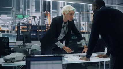 Aufkleber - Two Young Automotive Engineers Working in Office at Car Factory. Industrial Designer and Colleague Discussing Different Applications of a Metal Pinion Gear in Personal Mobility Vehicles.