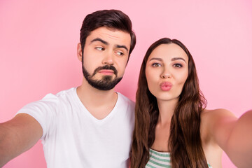 Poster - Photo of funny married couple shoot selfie girl send air kiss wear casual outfit isolated pink color background