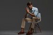 © Drobot Dean - Confident european business man sitting on chair
