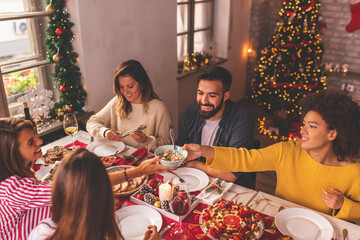 Canvas Print - Friends celebrating Christmas together