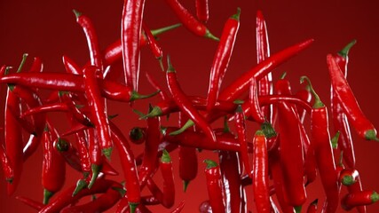 Poster - super slow motion of flying red hot chilli peppers. filmed on high speed cinema camera, 1000 fps