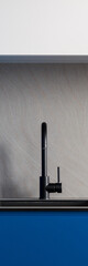 Wall Mural - Close-up on modern black kitchen tap, vertical panorama