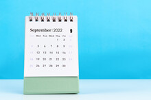 September 2022 Desk Calendar On Blue Background.