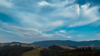 Wall Mural - Beautiful view of greenery-covered hills and mountains in Switzerland